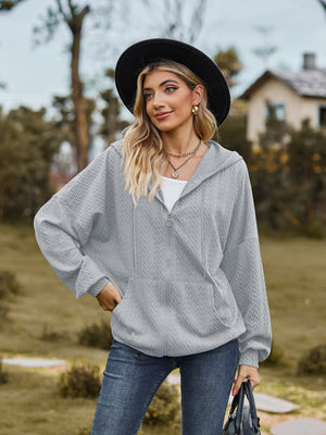 Textured knit dolman sleeve hoodie in Cloudy Blue with zip front and pockets.