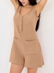 Khaki crinkled cotton button-down sleeveless romper with patch pockets.