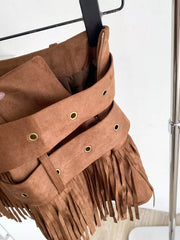 Brown suede mini skirt with fringe and antique brass grommet belt detail.