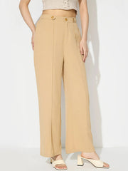 Tan tailored seam front wide leg trousers with button detail.