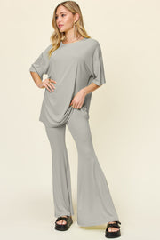 Light gray oversized tee and flare leg pants set with crew neck and short sleeves.