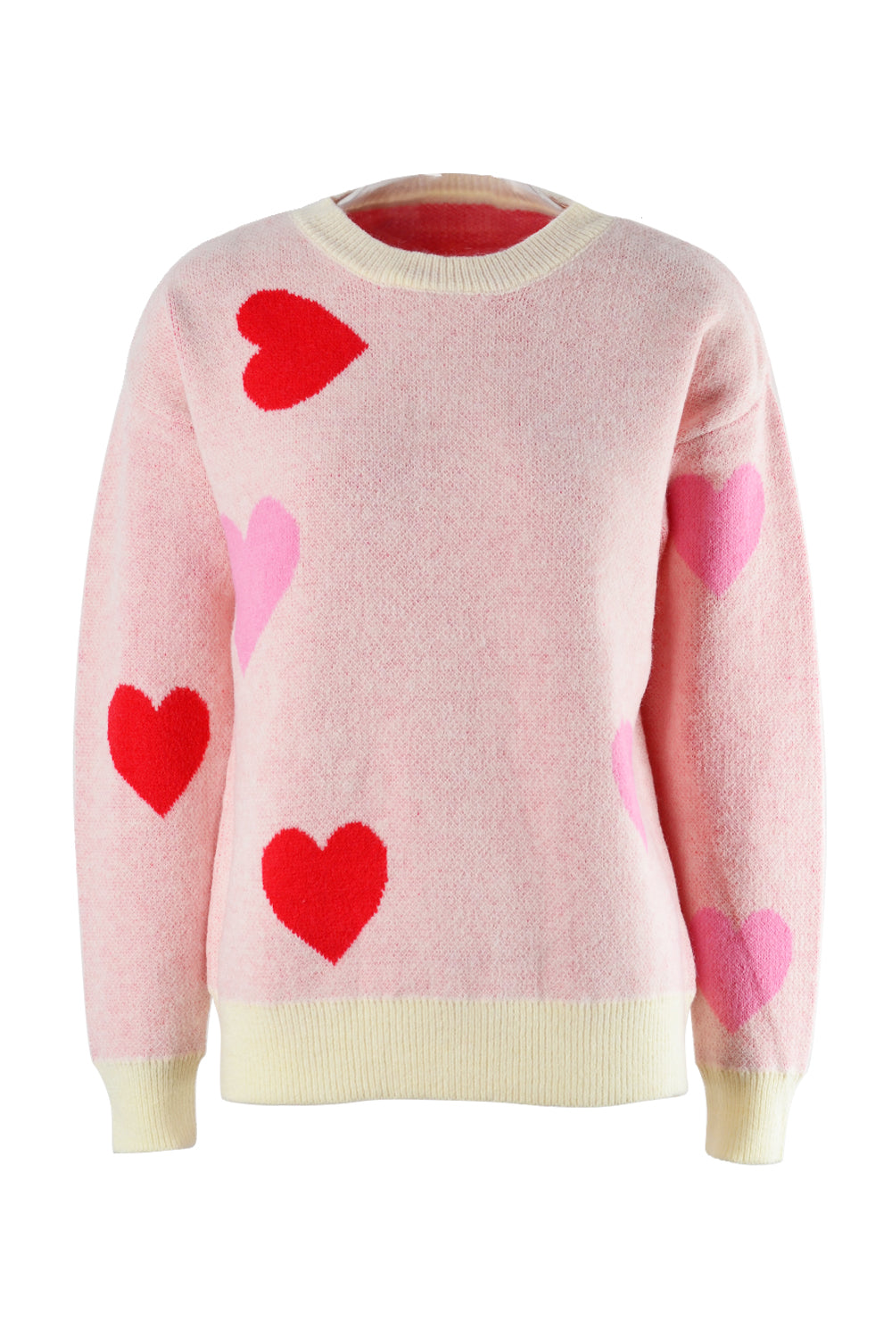 Blush pink crewneck sweater with red and pink intarsia hearts and cream trim.