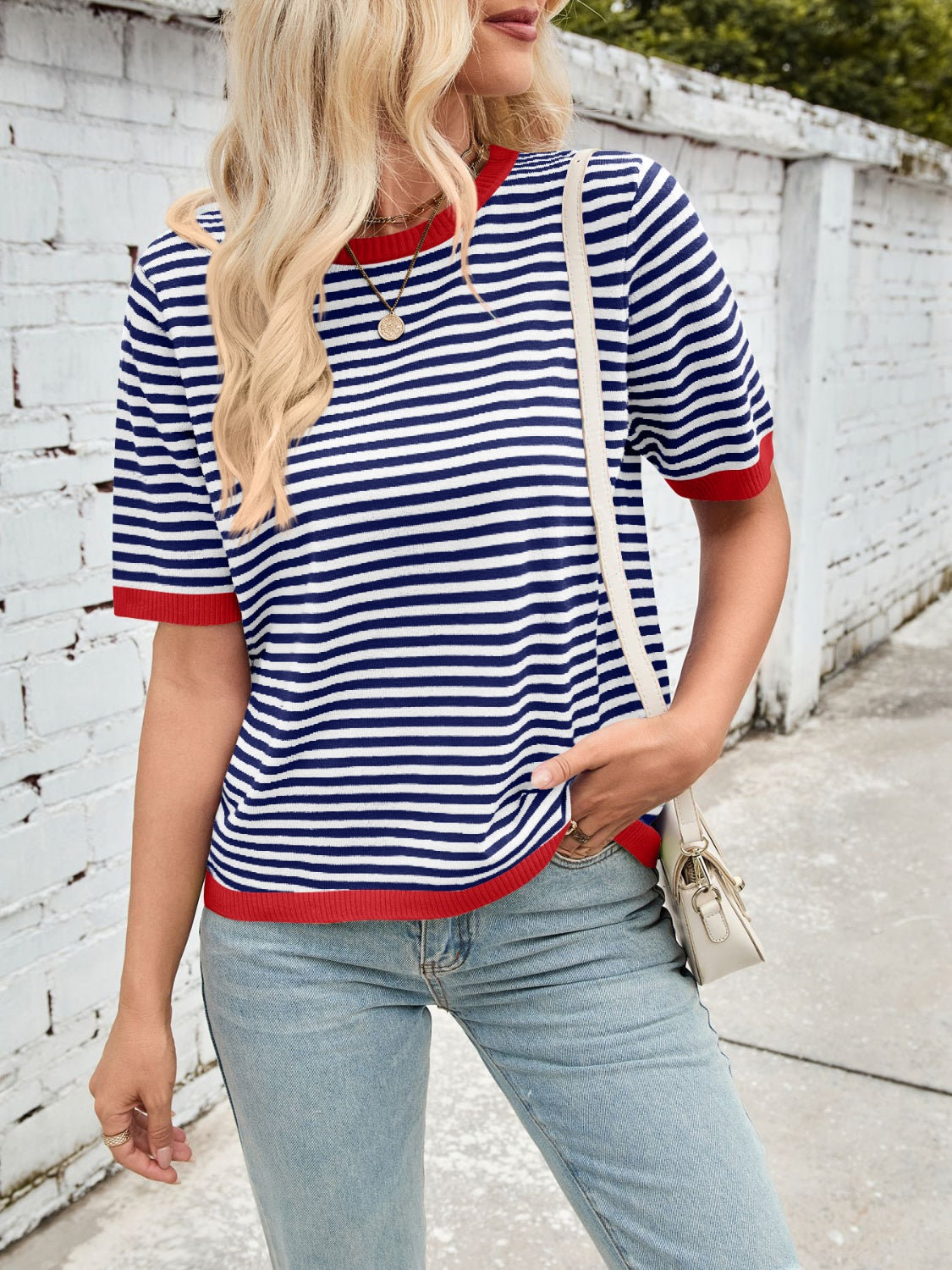 Nautical striped knit tee with red trim and crew neck.