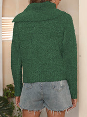 Dark green textured knit sweater with pearl buttons and a shawl collar.