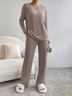 Brown ribbed knit V-neck loungewear set with long sleeves and wide-leg pants.