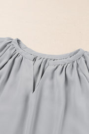 Gray relaxed V-neck blouse with gathered neckline and cap sleeves