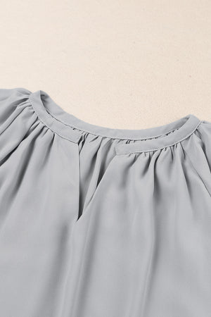 Gray relaxed V-neck blouse with gathered neckline and cap sleeves