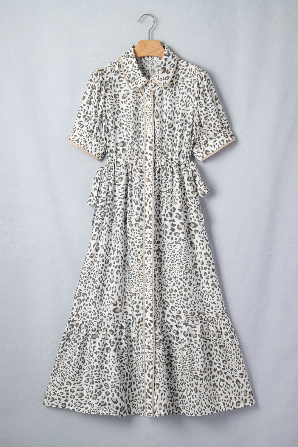 Print button-down midi dress with drawstring waist and leopard pattern.