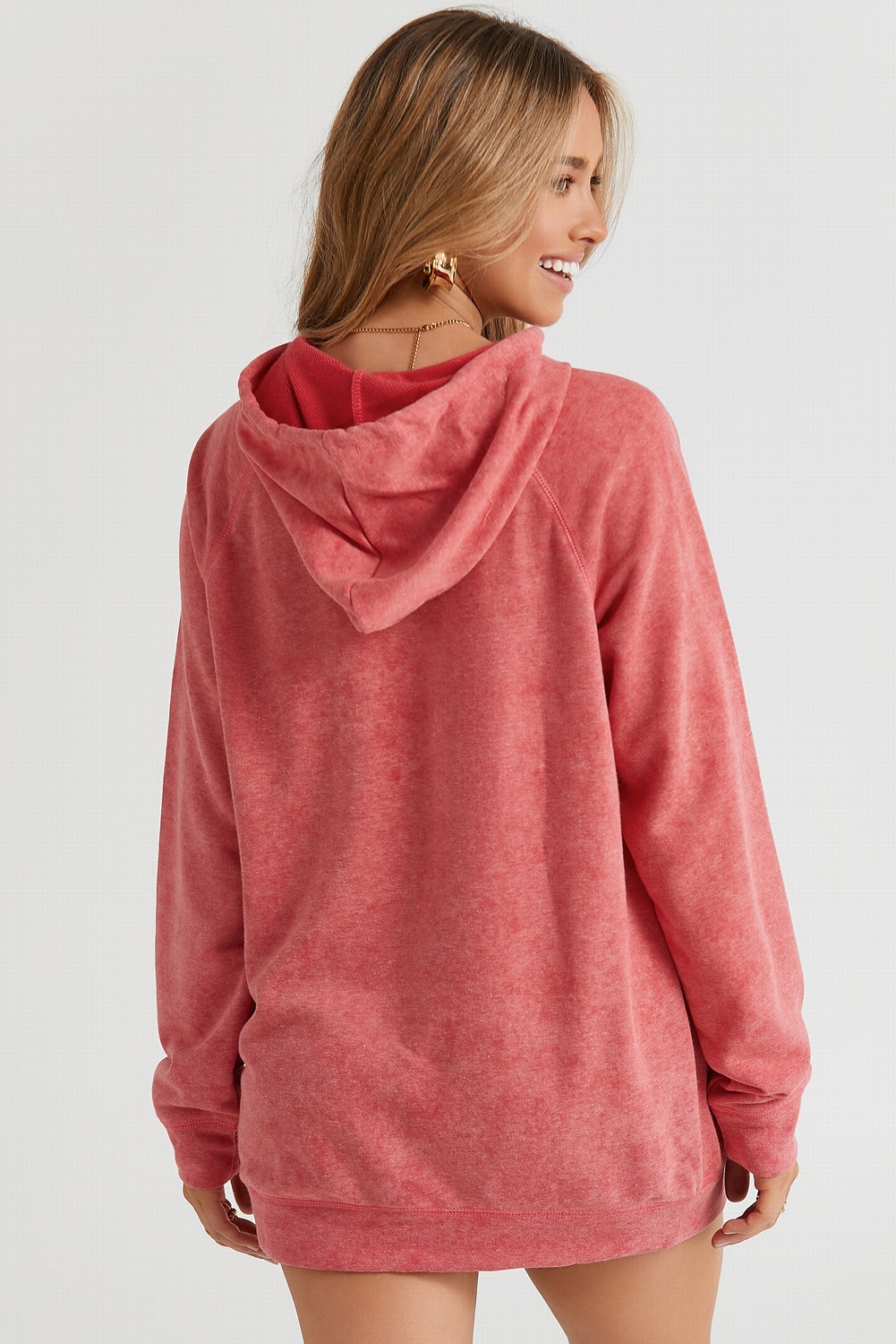 Coral textured raglan sleeve hoodie with a relaxed fit and drawstring hood.