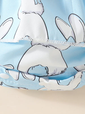 Sky blue baby dress with white bunny print and ruffled hem detail.