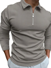 Gray textured zip-neck polo shirt with vertical stripes and long sleeves.