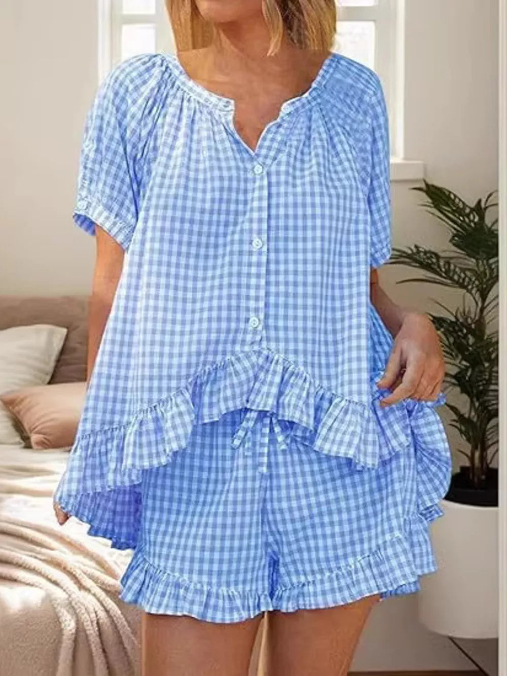Blue gingham two-piece set with ruffle trim and button-front top.