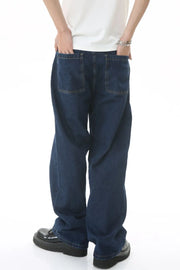 Baggy dark wash denim jeans with subtle flare and two back pockets.