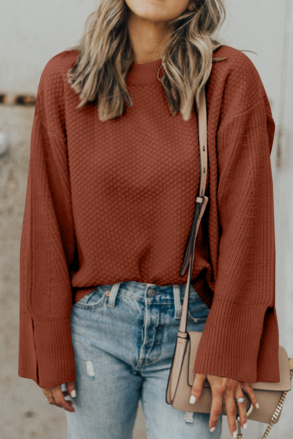 Textured knit sweater in ochre with crewneck and slit bell sleeves.