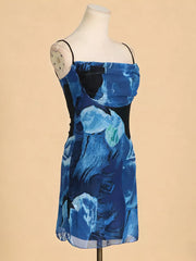 Blue abstract print spaghetti strap dress with ruched bodice detail.