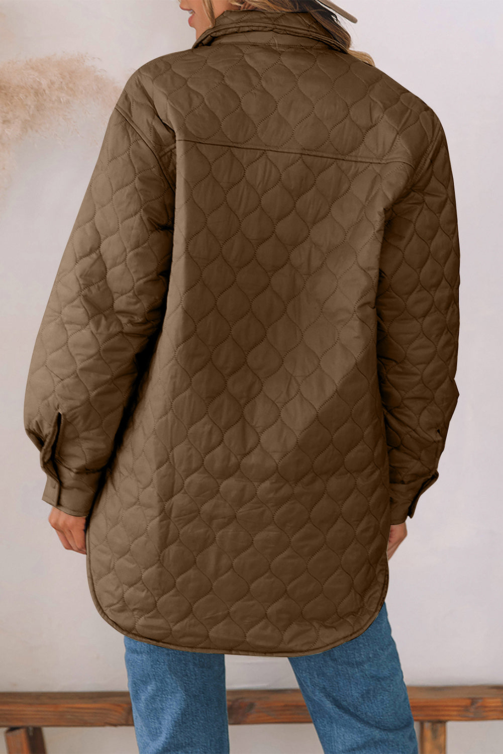 Quilted utility jacket in camel with a diamond pattern and button cuffs.