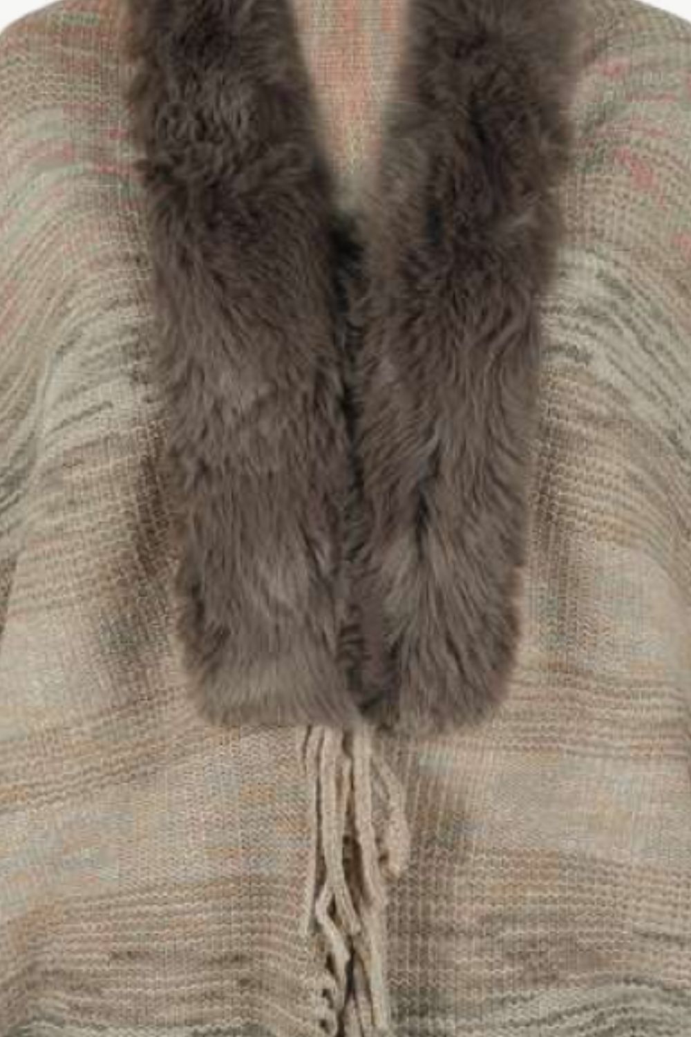 Textured knit cape in tan with faux fur collar and fringe detail