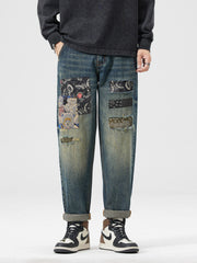 Men's distressed blue jeans with teddy bear and bandana patchwork details