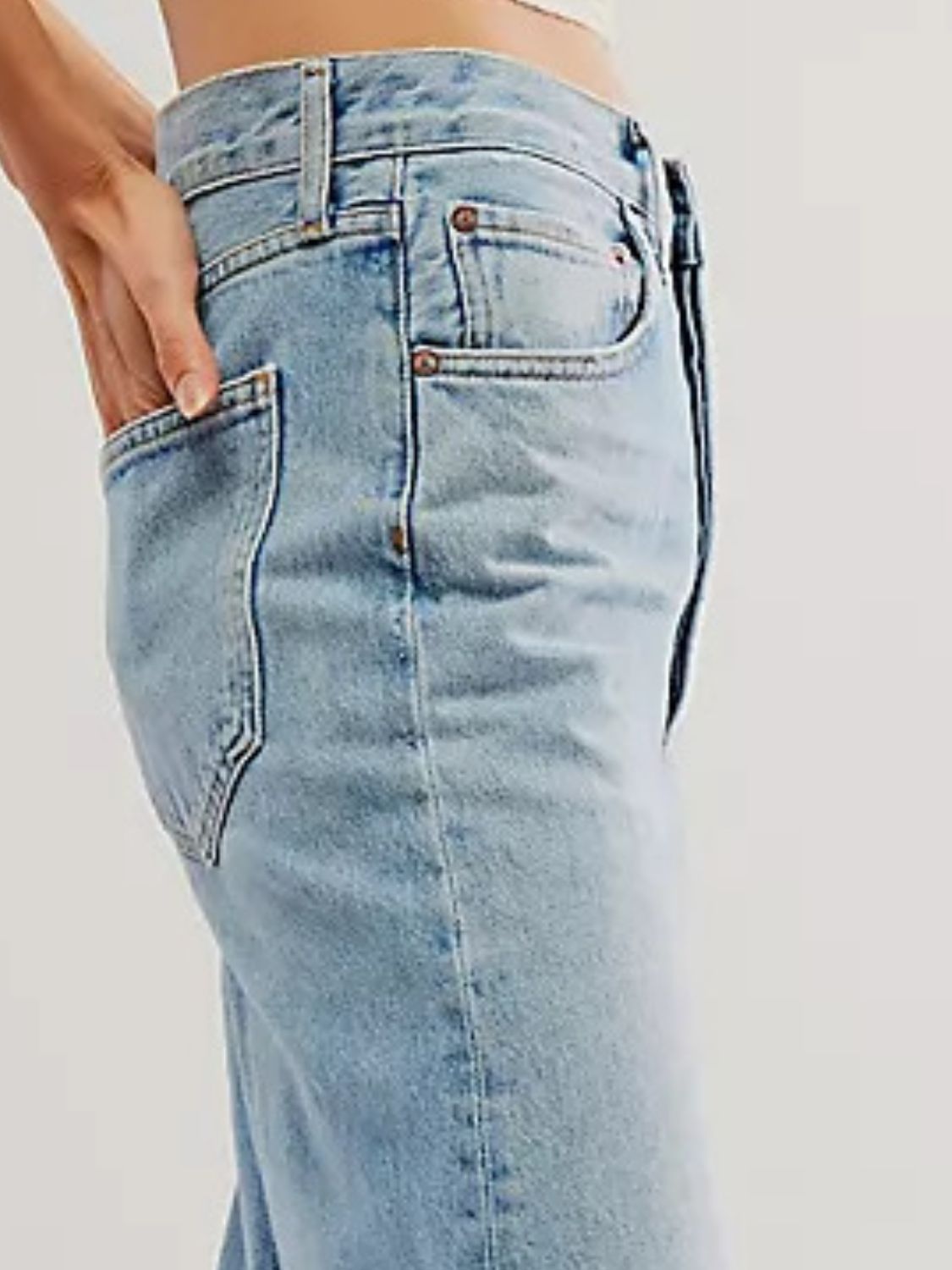 Light blue cuffed wide-leg denim trousers with a casual fit and pocket detail.