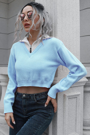 Light blue acrylic cropped sweater with zip detail and v-neck