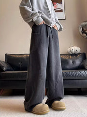 Men's vintage wash relaxed fit sweatpants in charcoal with drawstring and cargo pockets.