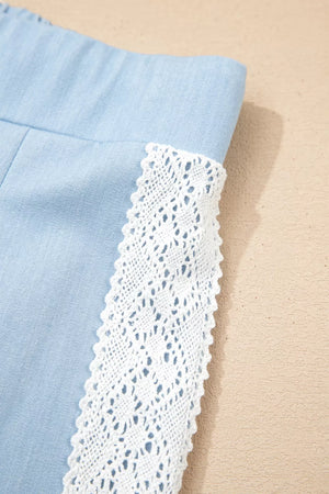 Light blue maternity pants with white lace trim detail