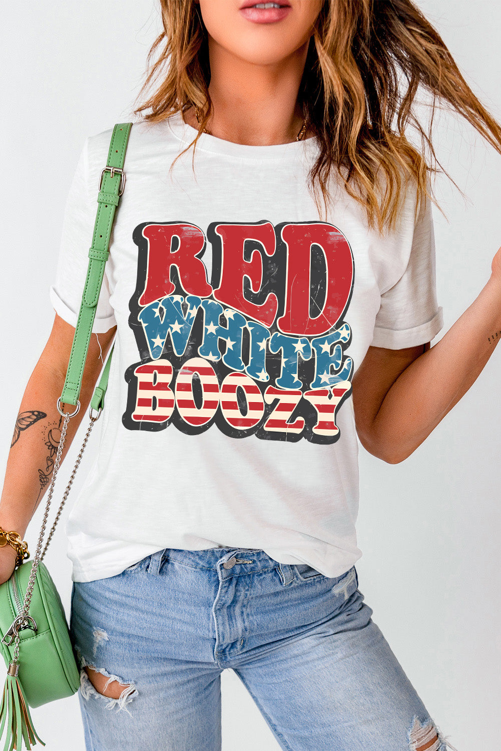 White cotton crewneck tee with distressed "Red White Boozy" graphic in patriotic colors.