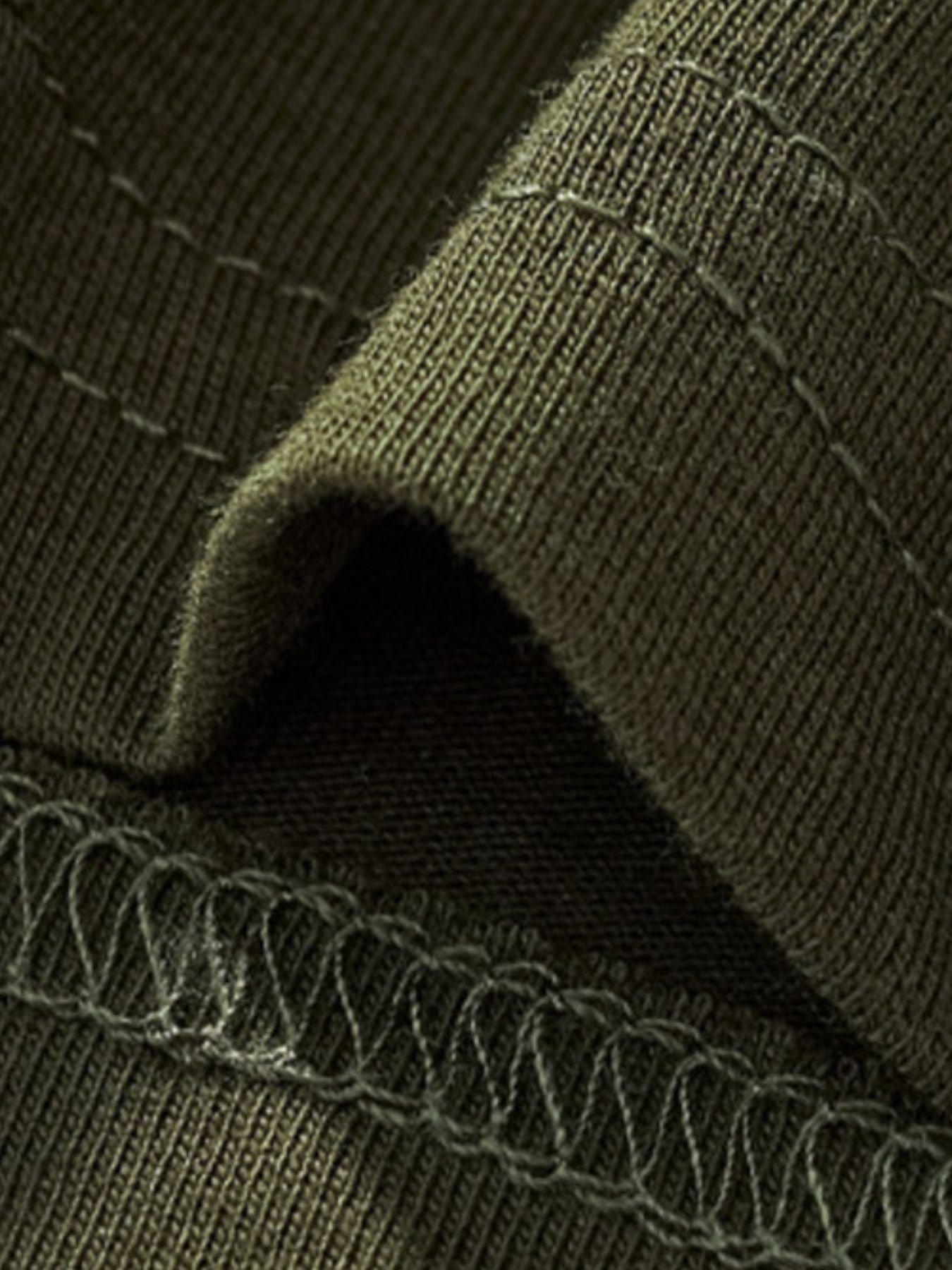 Toddler green crew neck t-shirt fabric detail with visible stitching.