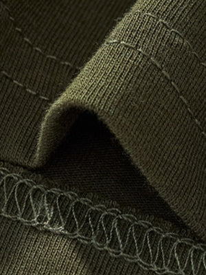 Toddler green crew neck t-shirt fabric detail with visible stitching.