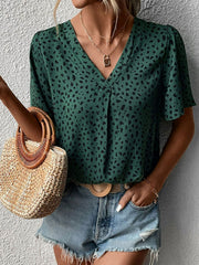 Emerald leopard print V-neck blouse with short flutter sleeves and a relaxed fit.