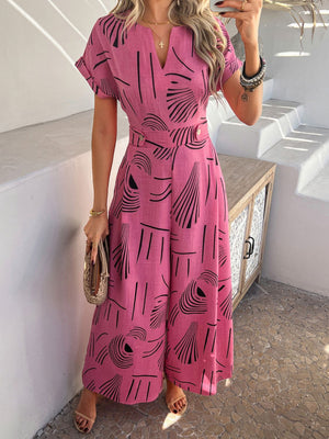 Hot Pink geometric print wide-leg jumpsuit with V-neck and short sleeves.