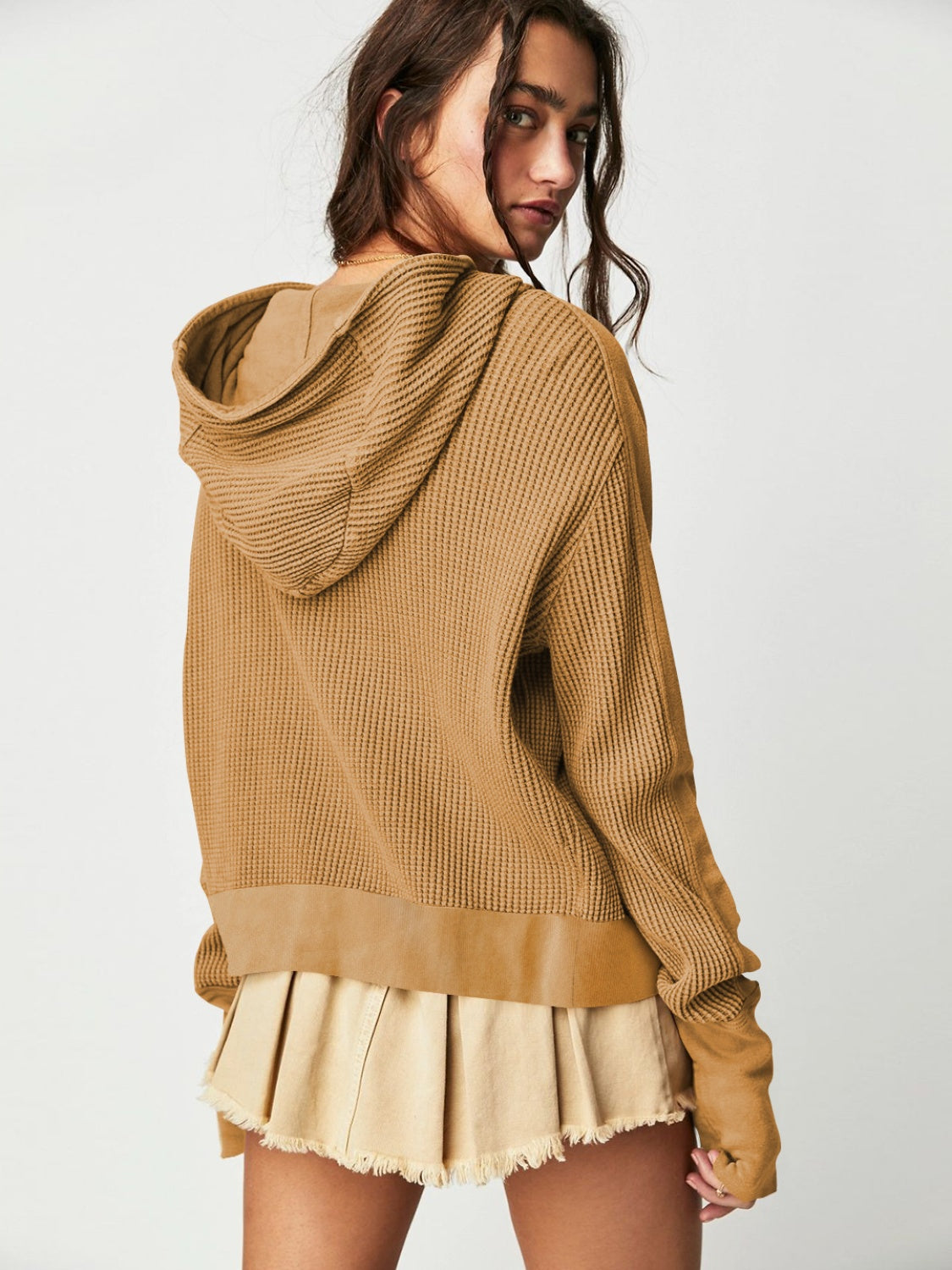 Camel waffle knit cropped hoodie with snap front detail and raw hem skirt.
