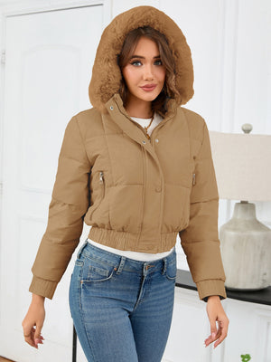 Camel puffer jacket with faux fur trim hood and zippered pockets.