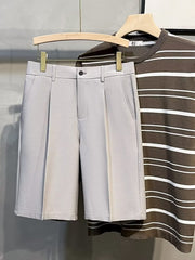 Light Gray Pleated Front Casual Men's Chino Shorts with button closure and side pockets.