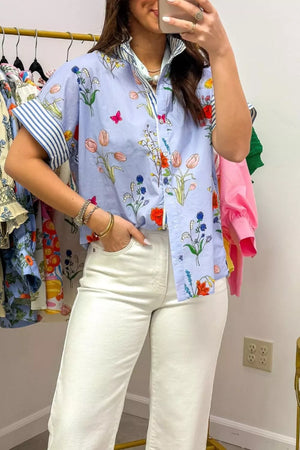 Maternity floral patchwork shirt with ruffled collar and striped cuffs, buttoned front.