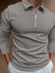 Gray textured zip-neck polo shirt with vertical stripes and long sleeves.