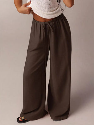 Brown maternity wide-leg pants with drawstring waist and relaxed fit.