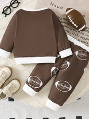 Brown baby top and pants set with white football print and ribbed cuffs.