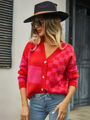 Checkerboard block knit cardigan in red and pink with button front and V-neck.