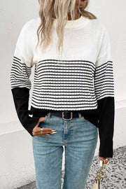 Colorblock stripe crewneck sweater in white and black acrylic with a casual fit.