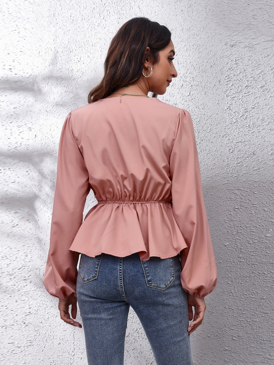 Dusty pink peplum blouse with balloon sleeves and gathered waist detail