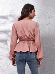 Dusty pink peplum blouse with balloon sleeves and gathered waist detail