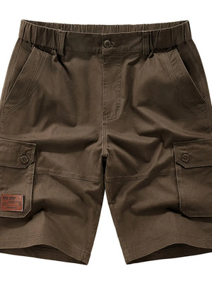 Coffee chino shorts with elastic waist, button fly, and cargo pockets.