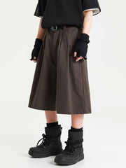 Men's plus size wide leg shorts in chocolate with pleats and a belted waist.