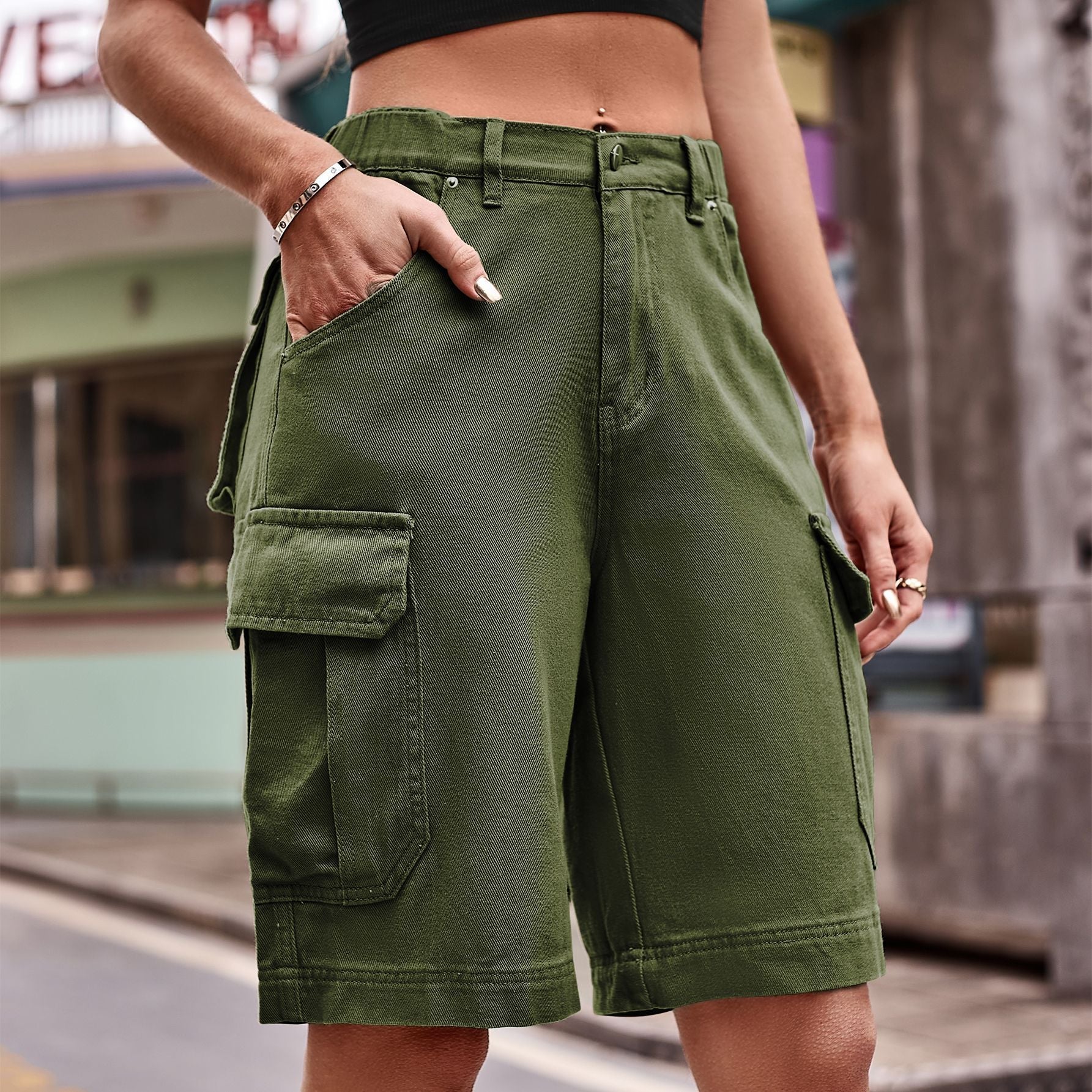 Army green denim cargo shorts with multiple pockets and a relaxed fit.