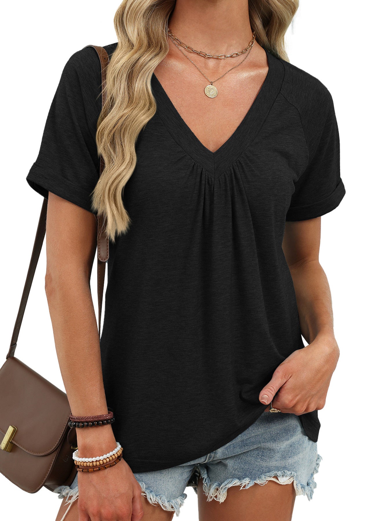 Black ruched V-neck short sleeve t-shirt with elastane, styled with denim shorts and a crossbody bag.