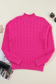 Hot pink cable knit mock neck pullover sweater with ribbed cuffs and hem.