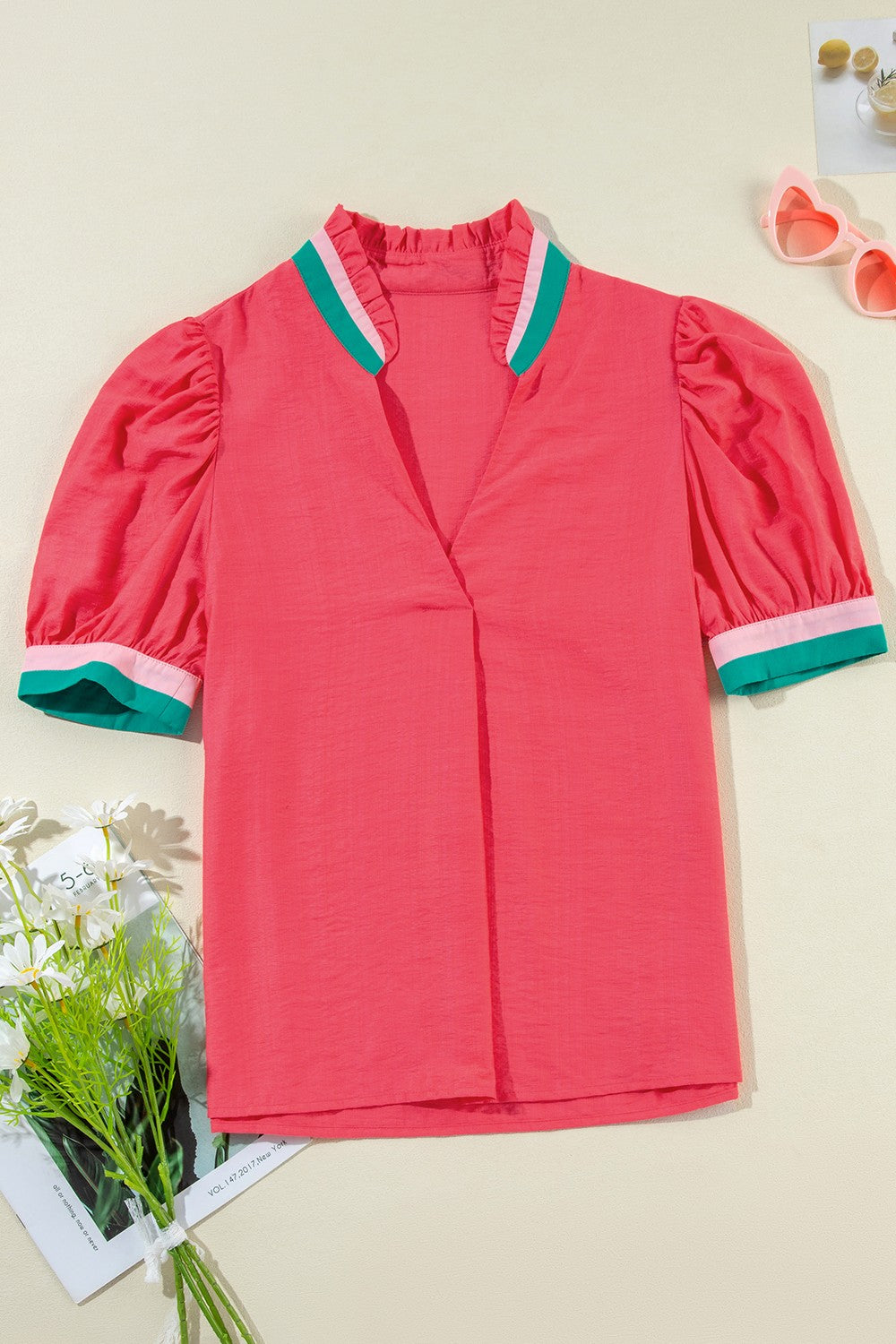 Colorblock puff sleeve blouse in strawberry pink with green and pink collar trim and sleeve cuffs.