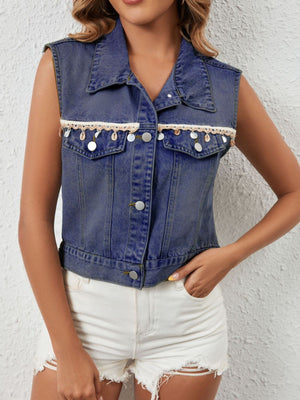 Classic button-up denim vest in dark blue with lace trim and shell embellishments