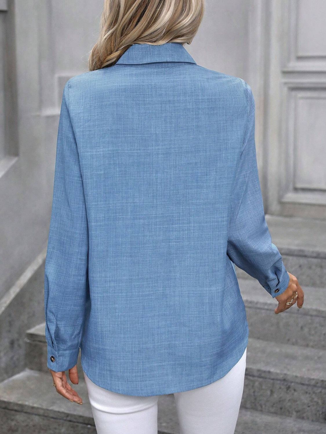Blue linen-blend button-down shirt with long sleeves and a collared neckline.